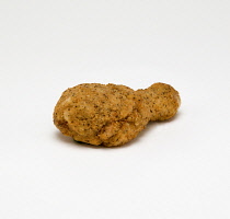 Food, Cooked, Poultry, Single breaded chicken drumstick on a white background.