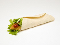 Food, Cooked, Poultry, Chicken wrap with lettuce, mayonaise and tomato ketchup on a white background.