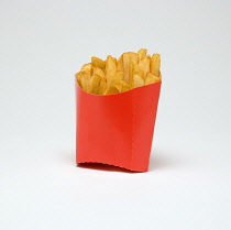 Food, Cooked, Vegetables, Portion of potato chips in a red cardboard container on a white background.