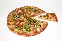 Food, Cooked, Pizza, Whole round hot jalapeno chilli pepper meat feast pizza with a slice cut out on a white background.