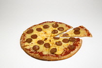 Food, Cooked, Pizza, Whole round pepperoni pizza with a slice cut out on a white background.