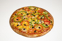 Food, Cooked, Pizza, Whole round vegetarian pizza on a white background.