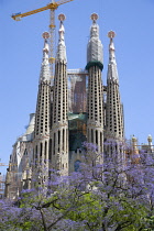 Spain, Catalonia, Barcelona, The spires of the basilica church of Sagrada Familia deisigned by Antoni Gaudi in the Eixample district.