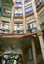 Spain, Catalonia, Barcelona, Detail of the central courtyard of Casa Mila apartment building known as La Pedrera or Stone Quarry designed by Antoni Gaudi in the Eixample district.