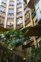 Spain, Catalonia, Barcelona, Detail of the central courtyard of Casa Mila apartment building known as La Pedrera or Stone Quarry designed by Antoni Gaudi in the Eixample district.