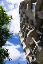 Spain, Catalonia, Barcelona, Facade of Casa Mila apartment building known as La Pedrera or Stone Quarry designed by Antoni Gaudi in the Eixample district.