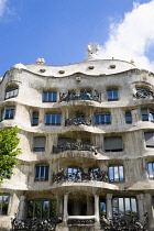 Spain, Catalonia, Barcelona, Facade of Casa Mila apartment building known as La Pedrera or Stone Quarry designed by Antoni Gaudi in the Eixample district.