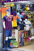 Spain, Catalonia, Barcelona, Sports goods shop in the Gothic Quarter with display of Barcelona Football Club kit.