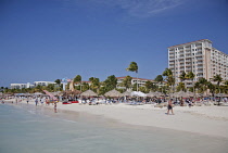 Dutch Antilles, Aruba, Oranjestad, Holidaymakers on Palm Beach.