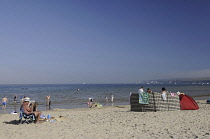 England, Dorset, Studland Bay, Knoll Beach with view towards Old Harry Rocks.