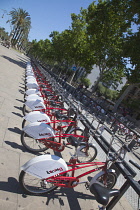 Spain, Catalonia, Barcelona, Parc de la Ciutadella, public hire bicycles next to Arc du Triomf.