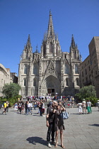 Spain, Catalonia, Barcelona, tourists outside the Cathedral of the Holy Cross and Saint Eulalia.