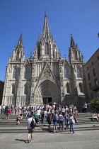 Spain, Catalonia, Barcelona, tourists outside the Cathedral of the Holy Cross and Saint Eulalia.