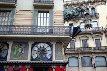 Spain, Catalonia, Barcelona, Dragon sculpture on Building in Placa de la Boqueria on La Rambla.