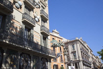 Spain, Catalonia, Barcelona, Dragon sculpture on Building in Placa de la Boqueria on the tree lined avenue of La Rambla.