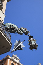 Spain, Catalonia, Barcelona, Dragon sculpture on Building in Placa de la Boqueria on  La Rambla.