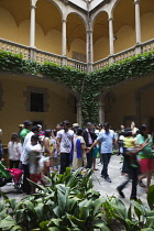 Spain, Catalonia, Barcelona, Tourists in the courtyard of the Crown of Aragon archive building.