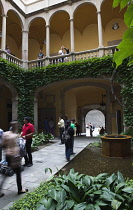 Spain, Catalonia, Barcelona, Tourists in the courtyard of the Crown of Aragon archive building.