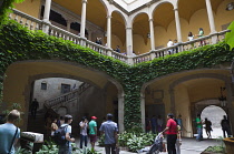 Spain, Catalonia, Barcelona, Tourists in the courtyard of the Crown of Aragon archive building.