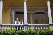 Spain, Catalonia, Barcelona, Tourists in the courtyard of the Crown of Aragon archive building.