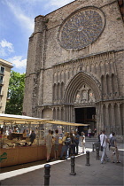 Spain, Catalonia, Barcelona, Art and farmers market in Placa del Pi next to Santa Maria del Pi church.