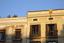 Spain, Catalonia, Barcelona, Detail of building in La Ribera with Catalan flag,