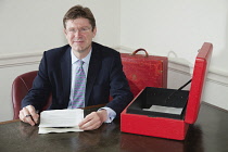 England, London, Greg Clark MP pictured at the Treasury Office with red box.