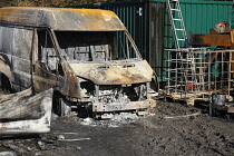 Transport, Road, Cars, Burnt out Ford Transit van in farmyard.