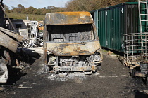 Transport, Road, Cars, Burnt out Ford Transit van in farmyard.