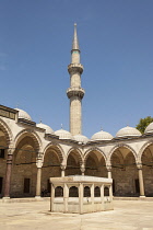 Turkey, Istanbul, A minaret and arches, Suleymaniye Mosque, from the inner courtyard.