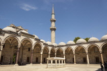 Turkey, Istanbul, A minaret and arches, Suleymaniye Mosque, from the inner courtyard.