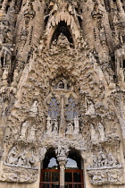 Spain, Catalunya, Barcelona, Basilica i Temple Expiatori de la Sagrada Familia, Generally known as Sagrada Familia, The Nativity facade showing the original detailed work of Antoni Gaudi.