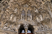 Spain, Catalunya, Barcelona, Basalica i Temple Expiatori de la Sagrada Famalia, Generally known as Sagrada Familia, The Nativity facade showing the original detailed work of Antoni Gaudi.