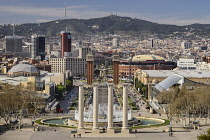 Spain, Catalunya, Barcelona, Placa d'Espanya and general vista towards Tibidabo mountain with Venetian Towers and Arenas de Barcelona bullring prominent in the central area.