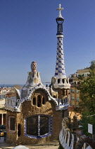 Spain, Catalunya, Barcelona, Parc Guell by Antoni Gaudi, full view of the Administration Lodge at the park's entrance.