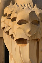 Spain, Catalunya, Barcelona, Antoni Gaudi's La Pedrera building, a section of chimney pots on the roof terrace.