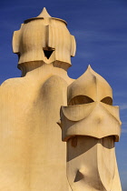 Spain, Catalunya, Barcelona, Antoni Gaudi's La Pedrera building, a section of chimney pots on the roof terrace.
