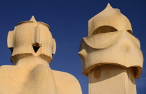 Spain, Catalunya, Barcelona, Antoni Gaudi's La Pedrera building, a section of chimney pots on the roof terrace.