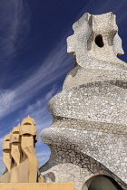 Spain, Catalunya, Barcelona, Antoni Gaudi's La Pedrera building, a section of chimney pots on the roof terrace.