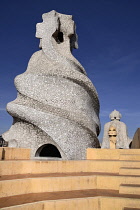 Spain, Catalunya, Barcelona, Antoni Gaudi's La Pedrera building, a section of chimney pots on the roof terrace.