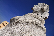 Spain, Catalunya, Barcelona, Antoni Gaudi's La Pedrera building, a section of chimney pots on the roof terrace.