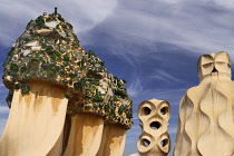 Spain, Catalunya, Barcelona, Antoni Gaudi's La Pedrera building, a section of chimney pots on the roof terrace.