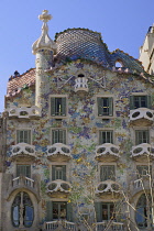 Spain, Catalunya, Barcelona, Casa Batllo by Antoni Gaudi, a section of the exterior facade.