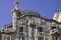 Spain, Catalunya, Barcelona, Casa Batllo by Antoni Gaudi, upper section of the exterior facade.