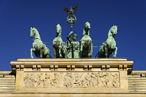 Germany, Berlin, The Brandenburg Gate, The Quadriga on top of the gate featuring a chariot drawn by four horses driven by Victoria the Roman goddess of victory or possibly Eirene goddess of peace.