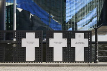 Germany, Berlin, Marie Elisabeth Luders Haus which is a service centre of the Bundestag located across the River Spree behind the Reichstag with memorial crosses to Berlin Wall victims in the foregrou...