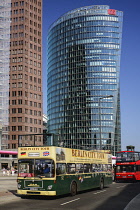 Germany, Berlin, Potzdamer Platz with Berlin City sightseeing tour bus in the foreground and Bahn Tower in the background.