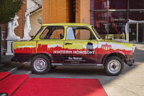 Germany, Berlin, Potzdamer Platz, Old Trabant car redecorated and now being used as advertising for a show.