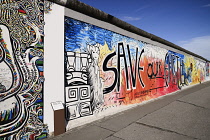 Germany, Berlin, The East Side Gallery, a 1.3  km long section of the Berlin Wall, Mural known as Save our Earth by Artist Indiano.