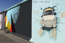 Germany, Berlin, The East Side Gallery, a 1.3  km long section of the Berlin Wall, Birgit Kinder's mural known as 'Test the Best' .